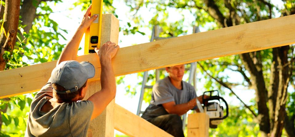 Builders Working on Frame of New House